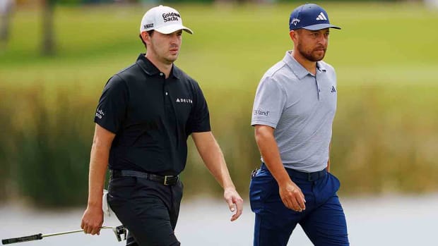 Patrick Cantlay and Xander Schauffele walk during the 2023 Zurich Classic of New Orleans.
